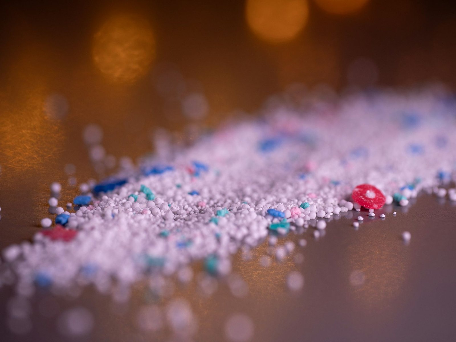 Coloured detergent powder granules
