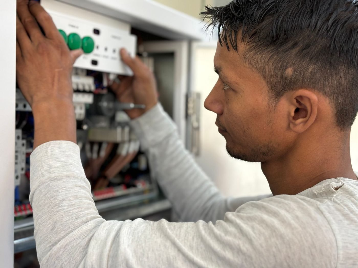 Engineer wiring components inside a control panel