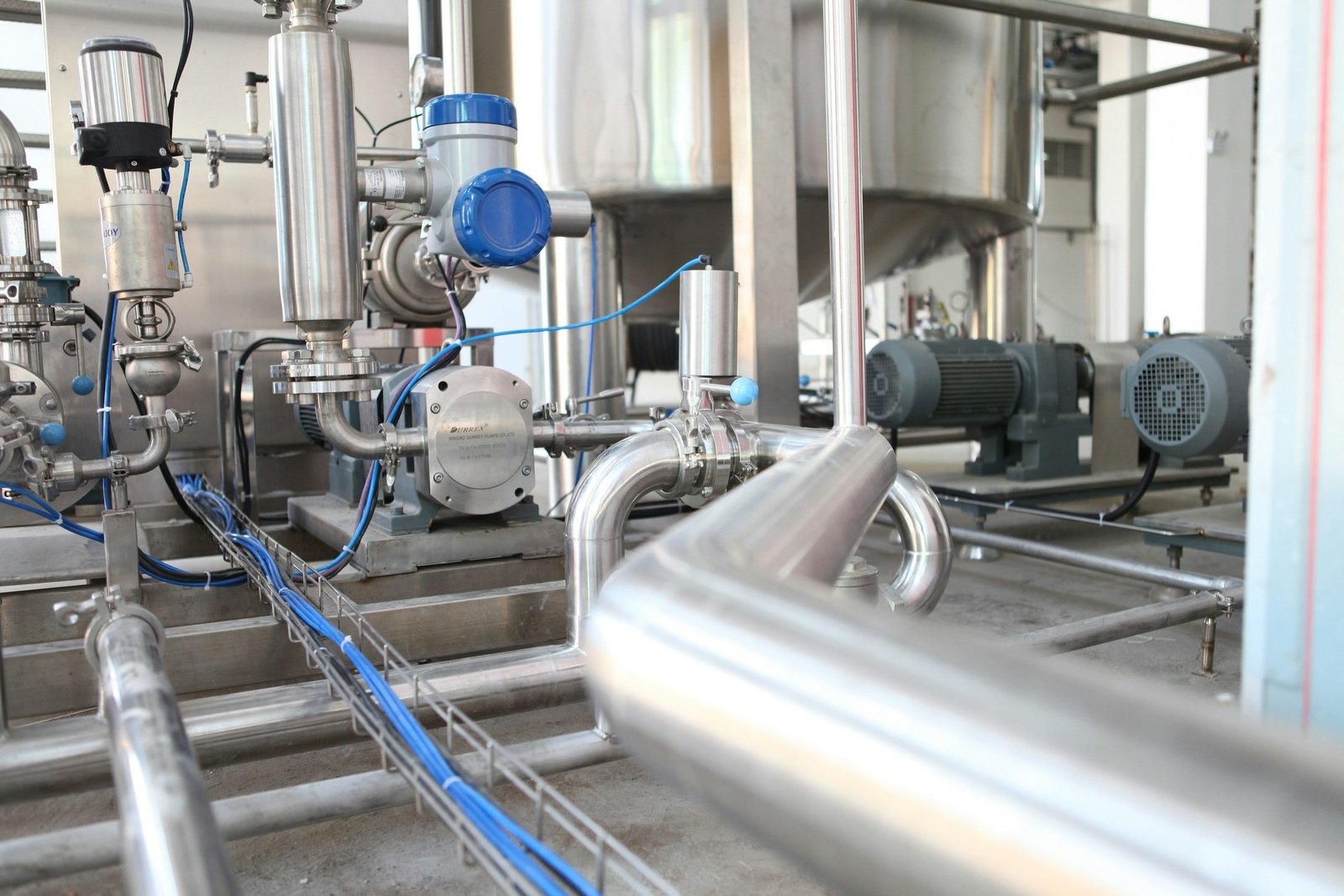 Stainless steel process skid with pumps, valves, instruments and cable tray