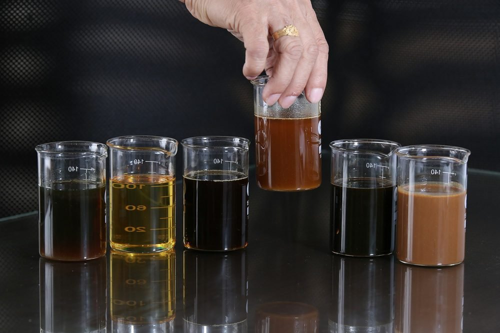 Samples of liquid surfactant in laboratory beakers